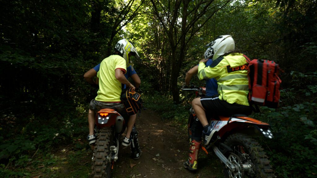 2 people riding on offroad bike