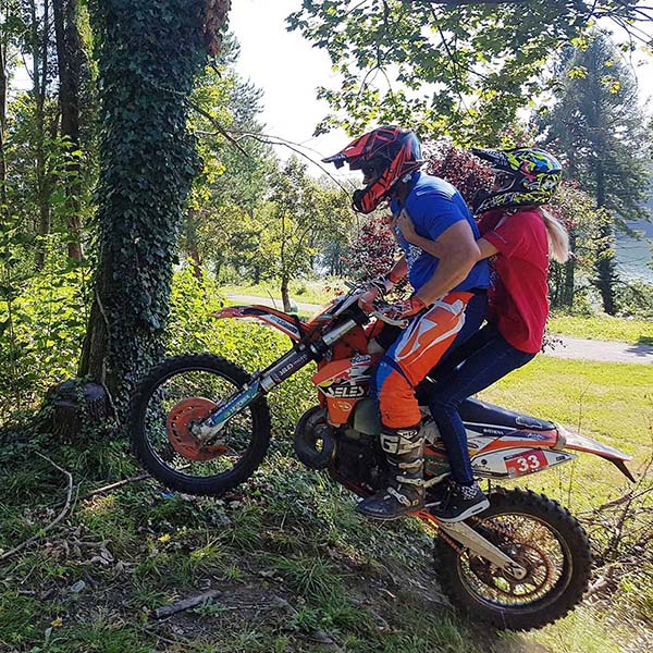 2 people on dirt Bike